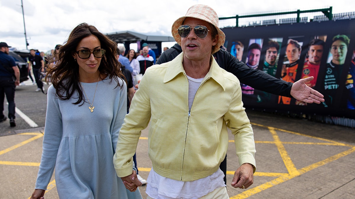 Brad Pitt and Ines de ramon walking hand in hand