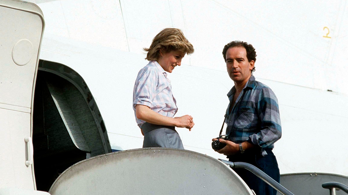 Richard Dalton with Princess Diana standing in front of a plane entrance.