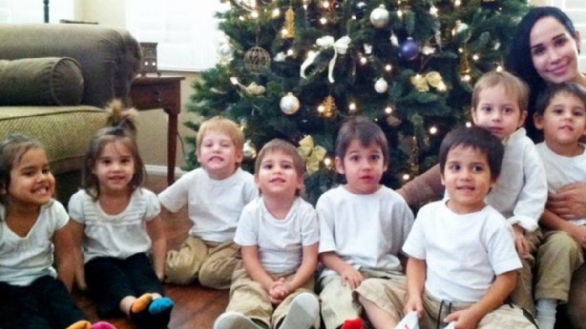 Nadya Suleman posing with her octuplets