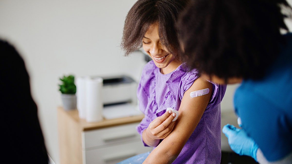 teen girl gets vaccinated