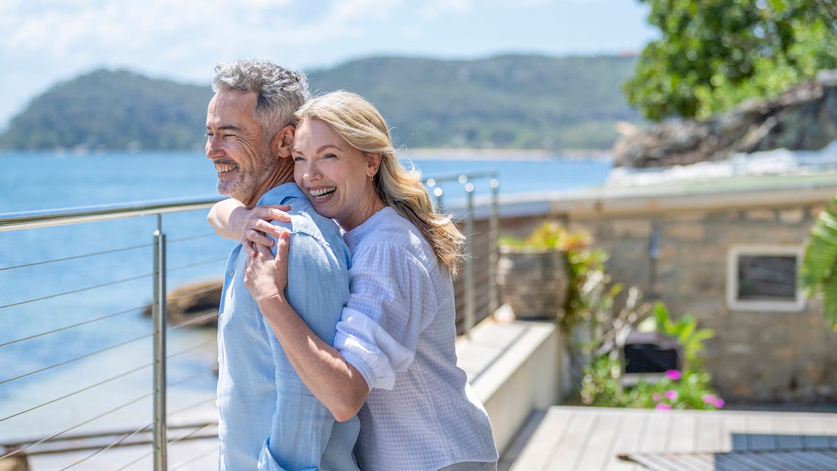 Mature couple embracing on vacation