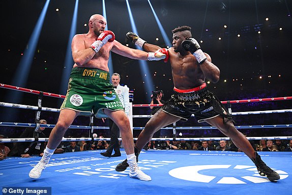 RIYADH, SAUDI ARABIA - OCTOBER 28: Tyson Fury and Francis Ngannou exchange punches during the Heavyweight fight between Tyson Fury and Francis Ngannou at Boulevard Hall on October 28, 2023 in Riyadh, Saudi Arabia. (Photo by Justin Setterfield/Getty Images)