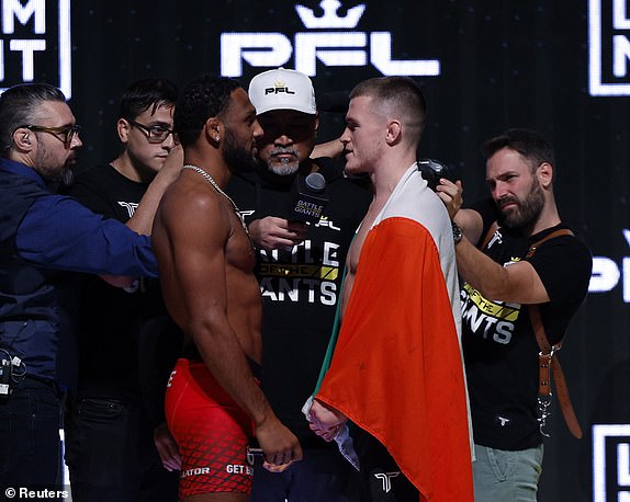 Mixed Martial Arts - Professional Fighters League Fight Night - Saudi Arabia - Weigh-In - Riyadh, Saudi Arabia - October 18, 2024 A.J. McKee and Paul Hughes go head to head during the weigh-in before their lightweight fight REUTERS/Hamad I Mohammed