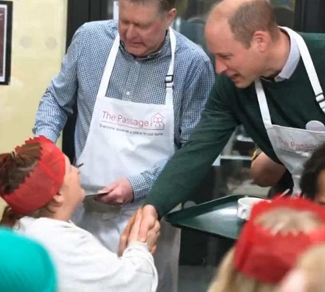 Wheres your hat, William? As dinner guests donned their festive paper hats from Christmas crackers, the royal shook hands with them