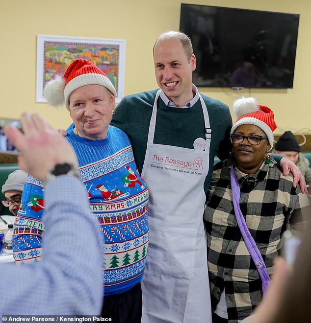 The Prince of Wales posed for photos with guests at The Passage - including one who was wearing a very festive jumper