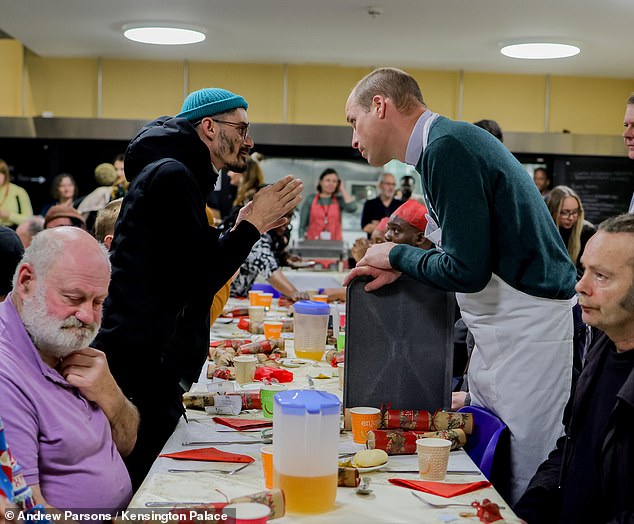 Father-of-three William appeared deep in conversation with one of the guests at the Christmas meal last year