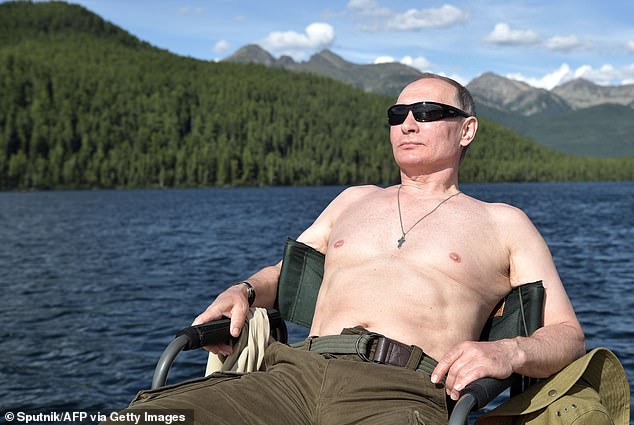 Russian President Vladimir Putin sunbathes during his vacation in the remote Tuva region in southern Siberia. The picture taken between August 1 and 3, 2017. Last month, it was revealed that Russian scientists had been ordered to handover details of their latest research in fighting ageing in a suspected bid to rejuvenate Putin