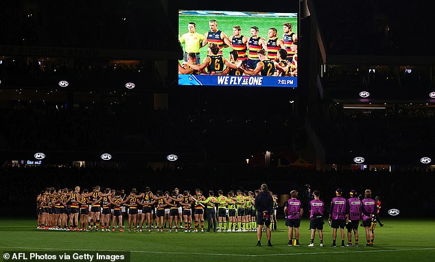 AFL players, coaches and umpires observed a minute of silence in tribute to victims of gender-based violence against women on August 30, 2024 (Pictured: Round 08 match in Adelaide)