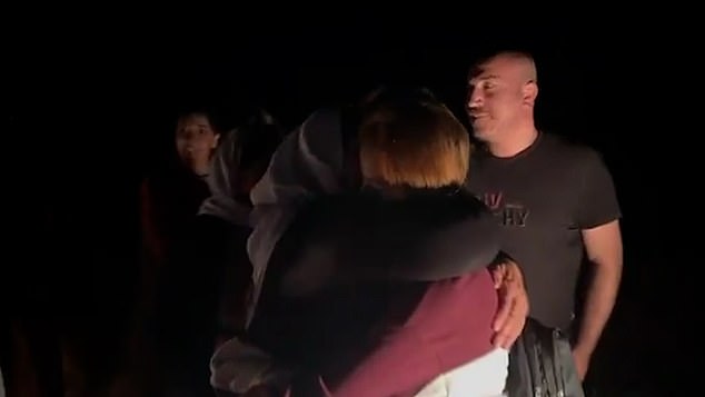 The young woman is seen hugging loved ones after reportedly spending a decade in captivity