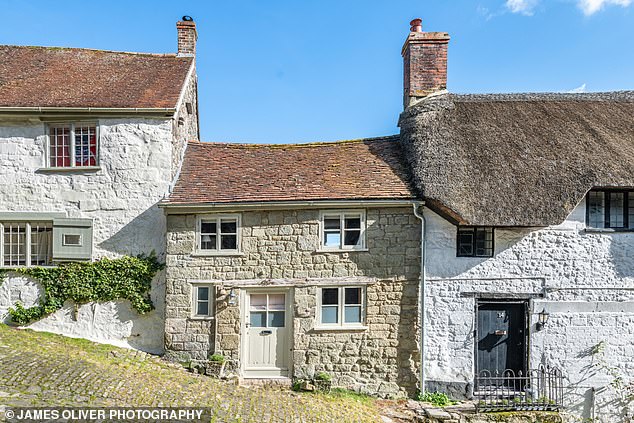 Hovis Hill is actually called Gold Hill and curves through Shaftesbury, Dorset. Button Cottage is the property in the middle in the image above