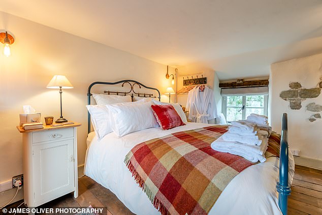 Dreamy: Above is Button Cottage's king-size bedroom