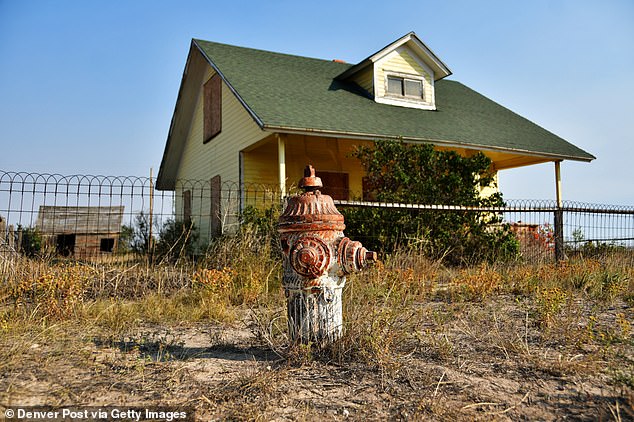 Pictured: A house in Keota that's in stunningly good condition, complete with a relic of a fire hydrant