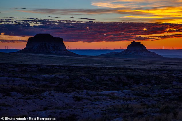 The sun rises on the Pawnee Buttes