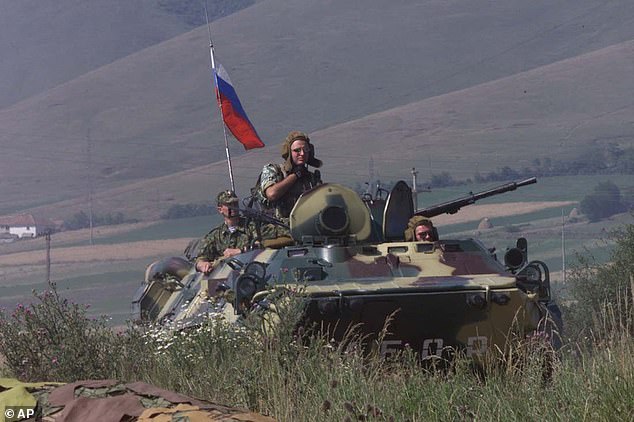 Russian troops guard the airport in Pristina, the capital of Kosovo, on June 28, 1999