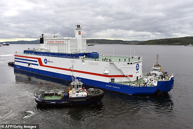 This handout picture taken and released on August 23, 2019, by the Russian nuclear agency ROSATOM shows the floating power unit (FPU) Akademik Lomonosov being towed from the Arctic port of Murmansk, northwestern Russia