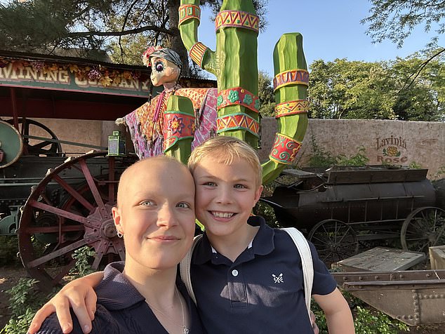 Liz and Mateo in Disneyland for a trip doctors weren't sure she was strong enough to make