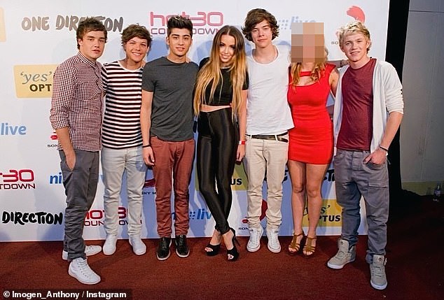 The influencer, 34, posted a photo to Instagram which captured her and a female friend posing up a storm with 1D when they were touring Down Under in 2012, as Imogen claimed her friend 'lost her virginity' to a band member that night. Pictured: Imogen and her friend with 1D