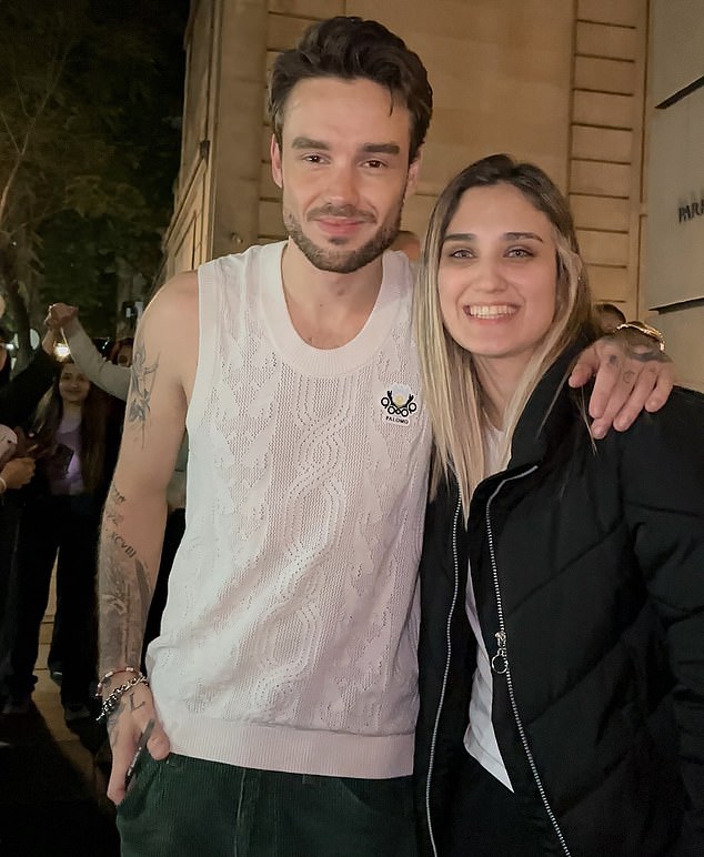 DURING HOLIDAY: Pictures have emerged of Payne posing for photos with his fans in Argentina