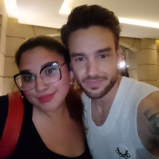 DURING HOLIDAY: Payne is seen smiling with a female fan during his trip to Buenos Aires