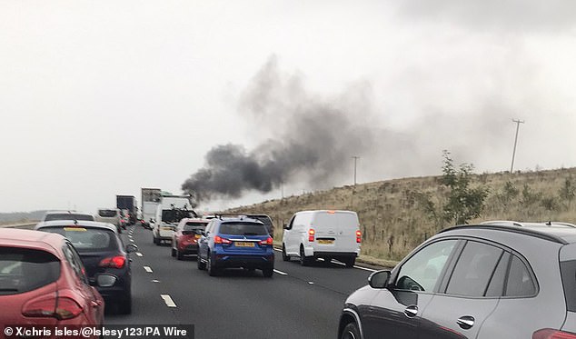 Smoke could be seen billowing from vehicles in the aftermath of the smash