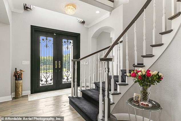 Pictured: The $25,000 front door was made with hurricane-grade glass and a decorative wrought iron grill