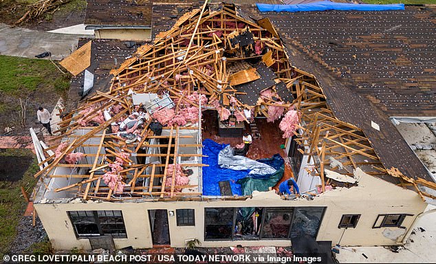 One Florida resident, Sam Rider, explained how his son clutched onto his arm when Rider was lifted in the air, off his feet, as the storm surged through his home ultimately ripping it apart. Pictured: Rider's home