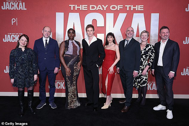 Also on the red carpet, Marianne Buckland, Gareth Neame, Lashana Lynch, Eddie Redmayne, Ursula Corbero, Nigel Marchant, Sue Naegle and Brian Kirk paused for a group photo together