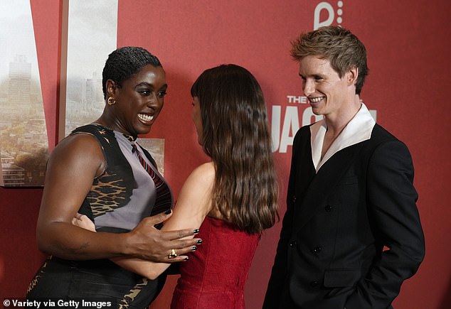 The pair also stepped into an embrace as Eddie joined in before the trio took a few pictures together ahead of the screening