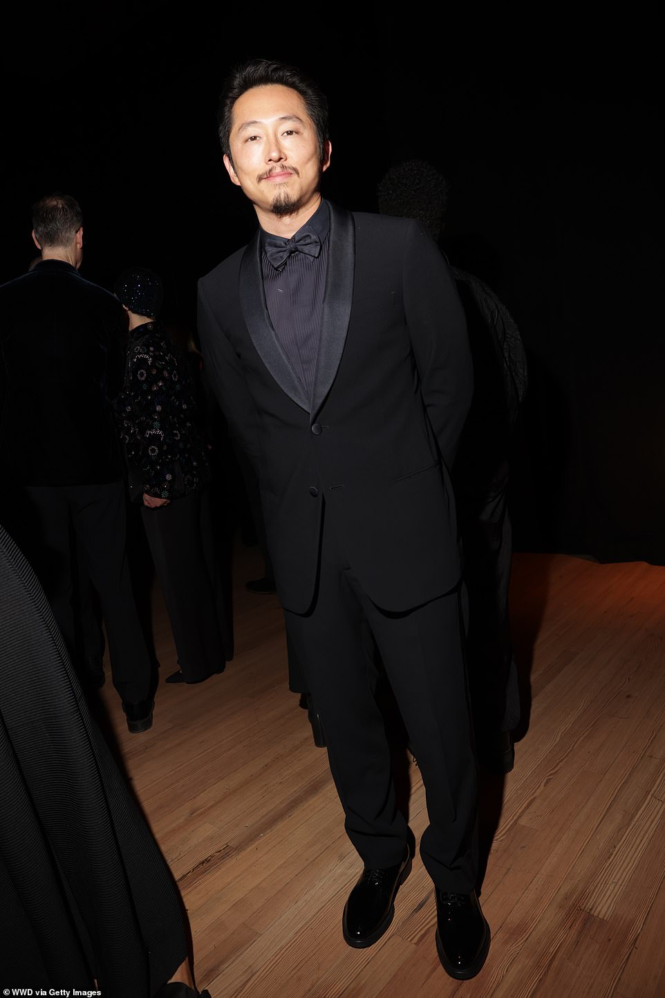 Beef star Steven Yeun looked ultra chic in an all-black outfit that included a tuxedo jacket and bow tie