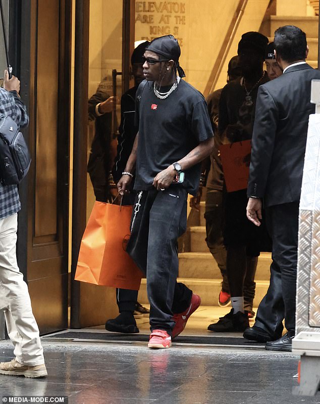 Travis appeared to have had a successful shopping trip as he was seen stepping out of the Hermes shop with a large orange bag