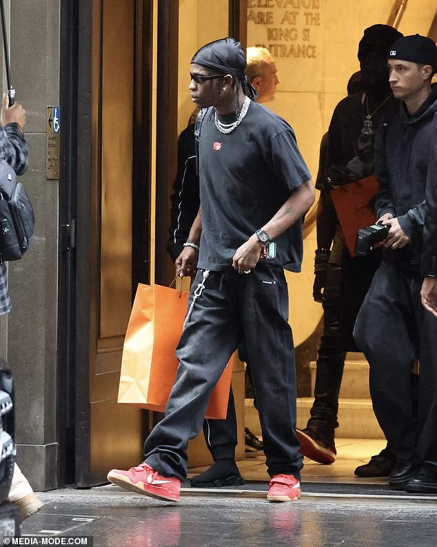 He added a pop of colour to his casual ensemble with a pair of red trainers and accessorised with an array of chunky silver jewellery