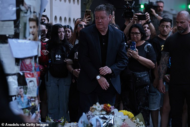 Payne's father, Geoff, traveled to Buenos  Aires on Friday to claim his son's body. He was greeted with an outpouring of grief and support by fans mourning the late singer