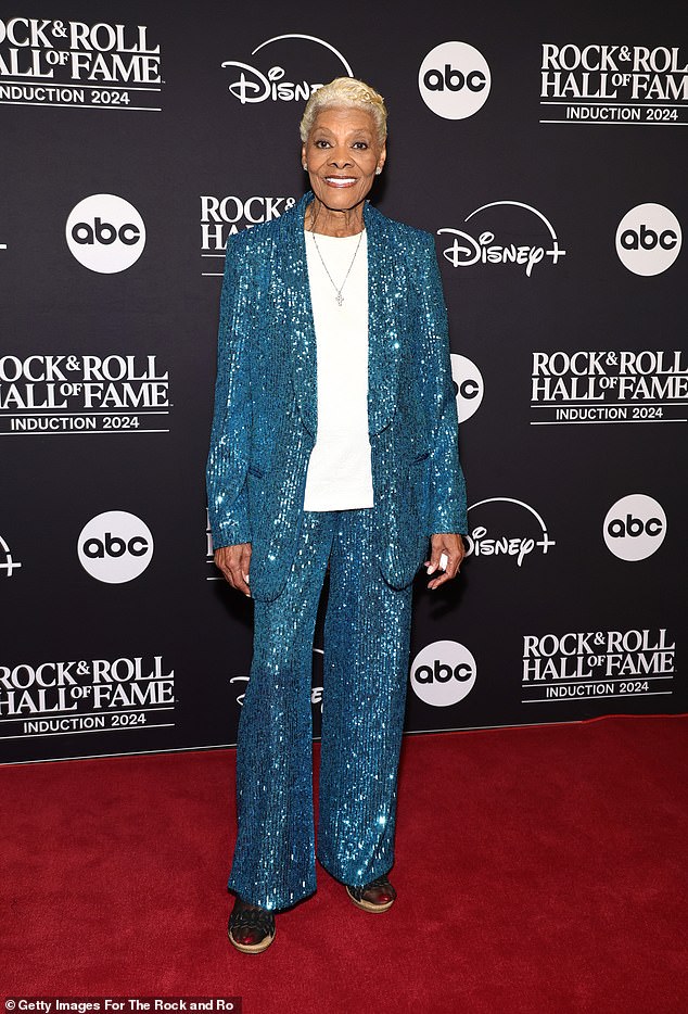 Dionne Warwick was mesmerizing in a bright blue, sequined blazer with matching, semi-flared pants. The 83-year-old music icon sported a classic, white tunic top with the co-ord and donned black, leather sandals