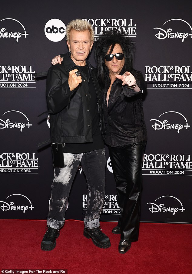 On the red carpet, he also posed with Steve Stevens, his guitarist and songwriting collaborator. The Grammy winner, 65, looked cool in a halfway-unbuttoned, patterned shirt paired with leather slacks and shiny boots