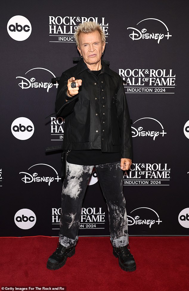 Billy Idol showed off his star power as he arrived at the event and posed on the red carpet. The 68-year-old singer-songwriter looked effortlessly stylish in a nylon moto jacket paired with bleach-dyed jeans and chunky boots