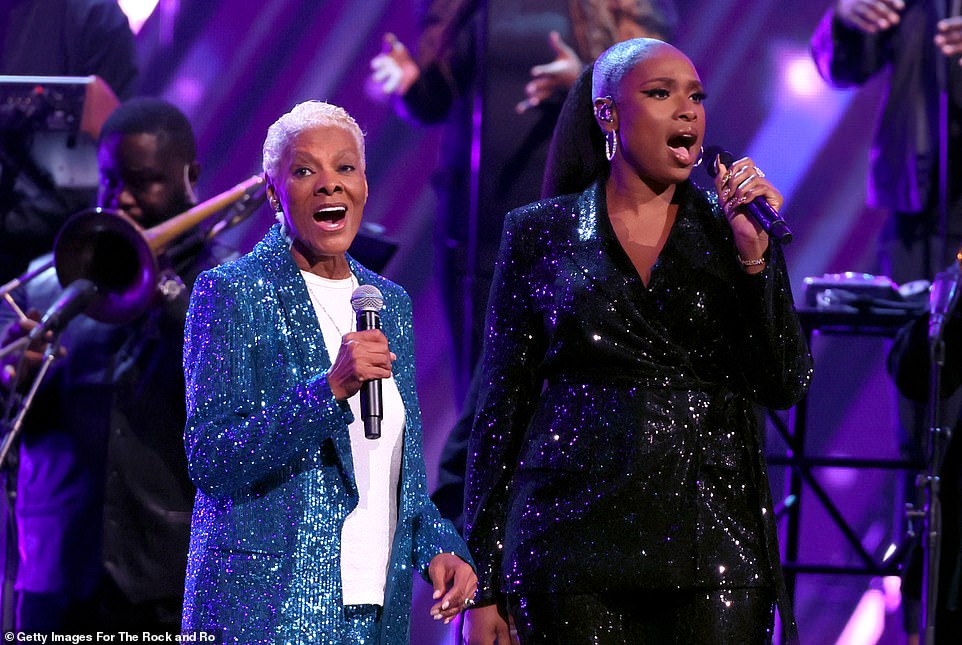 The pair were seen standing side-by-side underneath the bright stage lights as Hudson took part in her tribute to Warwick