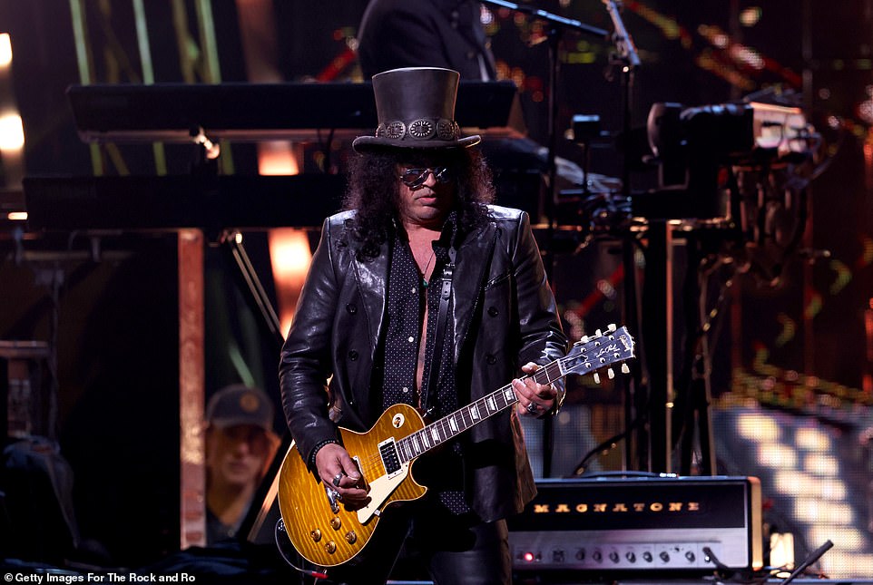 The guitarist sported an all-black ensemble and a black hat that was placed on top of his head for the evening