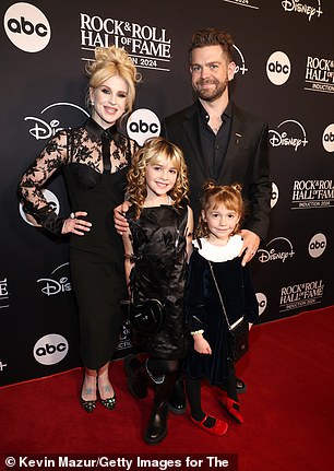 The media personality, 38, and his kids all coordinated in matching, all-black outfits for the event