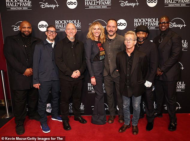 Ahead of inducting the band into the Rock and Roll Hall of Fame, the actress, 56, joined the musicians on the red carpet; pictured from left to right: Rashawn Ross, Stefan Lessard, Jeff Coffin, Julia Roberts, Dave Matthews, Tim Reynolds, Carter Beauford and Buddy Strong