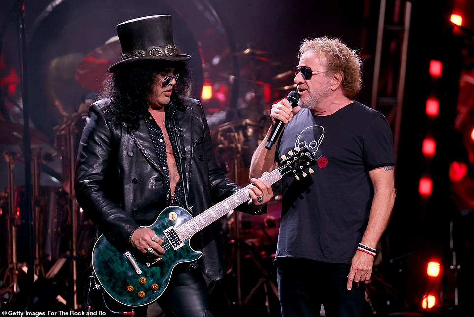 Hagar sang lyrics into a microphone as Slash picked up a different guitar to play during the special tribute