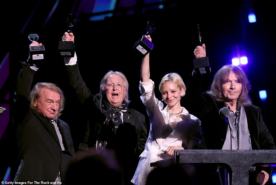 After being inducted into the Rock & Roll Hall Of Fame, Lou Gramm, Rick Wills, Annabelle Dexter-Jones (daughter of Mick Jones) and Al Greenwood proudly held their awards