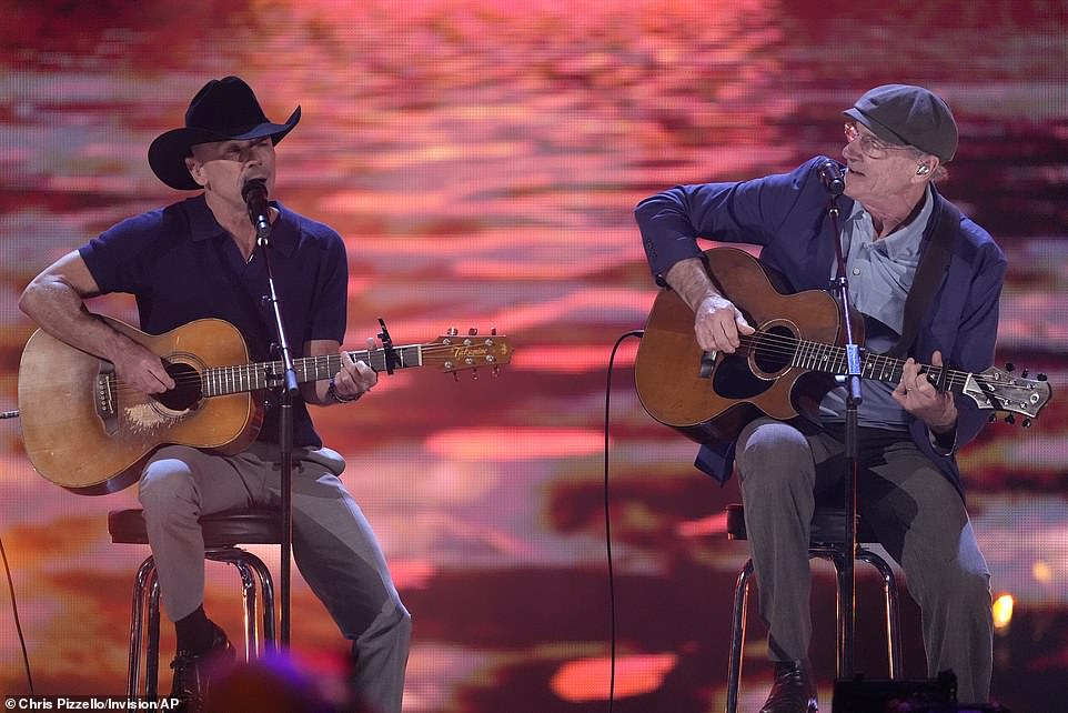 A depiction of a sunset was shown on a screen behind the trio during the song, while soft orange lights also lit up behind them