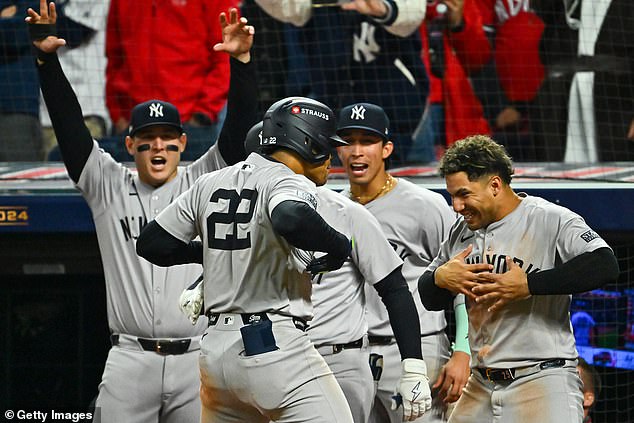 Soto celebrates with his Yankees teammates after hitting the go-ahead home run in the tenth