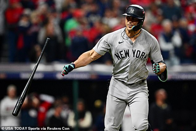 Giancarlo Stanton tosses his bat after tying the game in the sixth inning with a home run