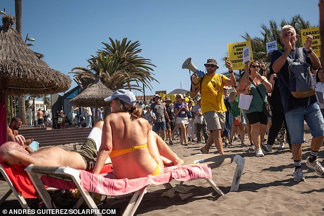 The anti-mass tourism march shocked holidaymakers sunning themselves