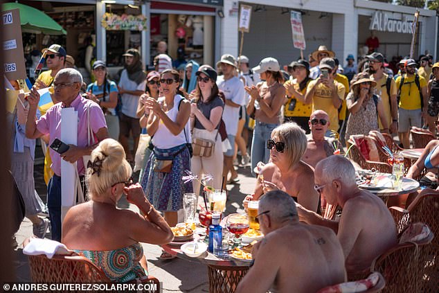 There were no reports of any violence but protesters, whose banners included one in English which said 'Go Home Tourist' are said to have been mocked and taunted