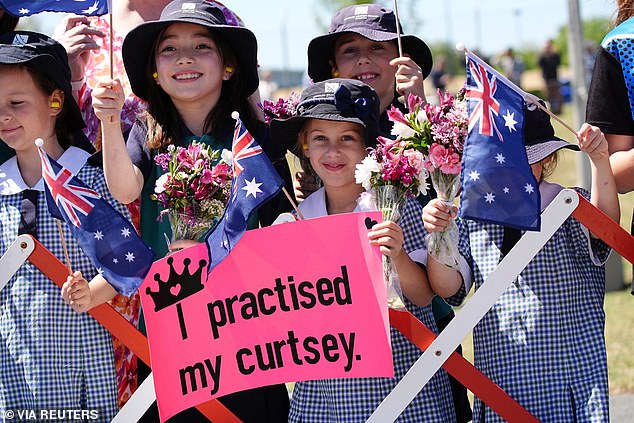 They were welcomed by cheering crowds and schoolchildren waving Australian flags