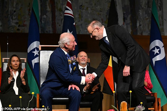 King Charles shakes hands with Australian Prime Minister Anthony Albanese while attending a Parliamentary reception at Parliament House in Canberra