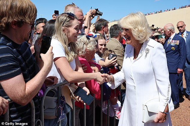 Camilla wore a stunning white dress as she beamed at excited royal wellwishers