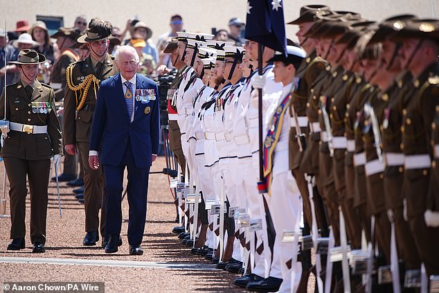 King Charles III views The Royal GUard of Honour during the Ceremonial Welcome to Australia at Australian Parliament House in Canberra